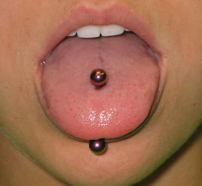 to a slightly more aggressive tongue piercing:
